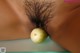 A close up of a woman's butt with a green apple on it.